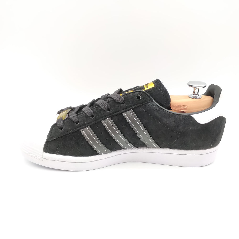 Adidas Superstar noir avec bandes grises