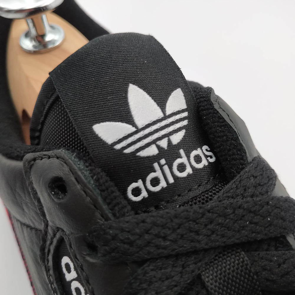 Adidas Continental 80 cuir noir et bandes rouges