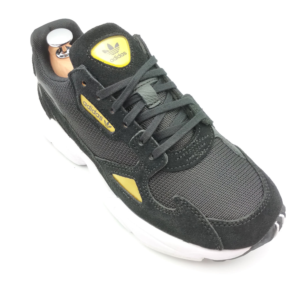 Adidas Falcon noir avec motifs dorés