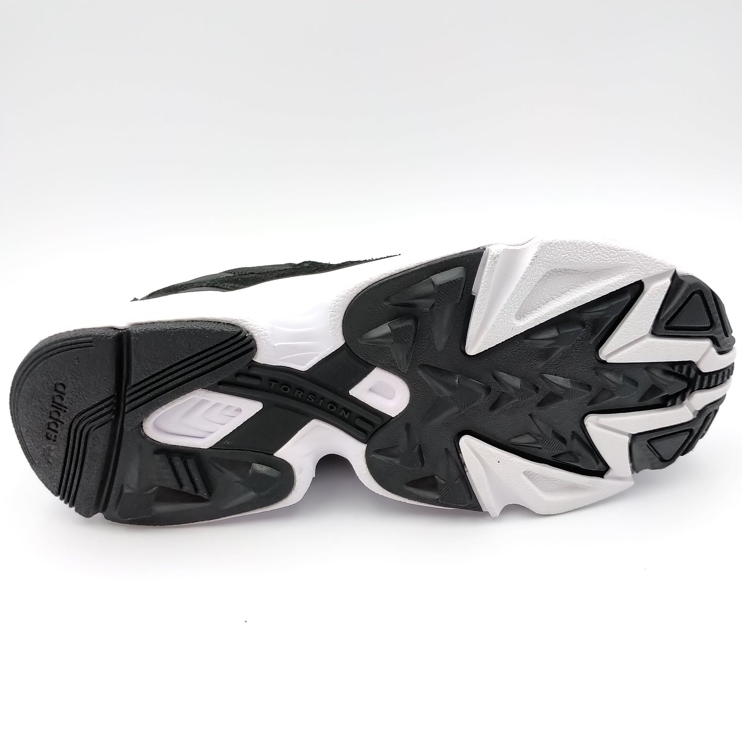 Adidas Falcon noir avec motifs dorés